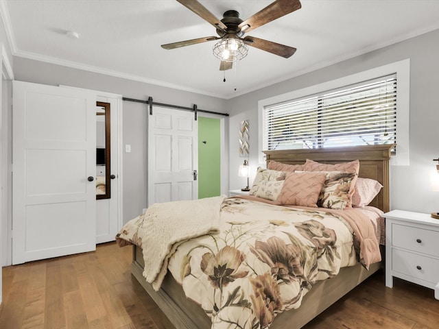 616 Stoneybrook Dr, Wylie, TX 75098 - bedroom with dark wood-style floors, a barn door, ornamental molding, and ceiling fan