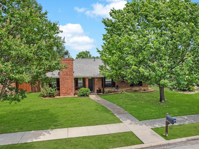616 Stoneybrook Dr, Wylie, TX 75098 - view of front of house featuring a chimney, a shingled roof, and brick siding