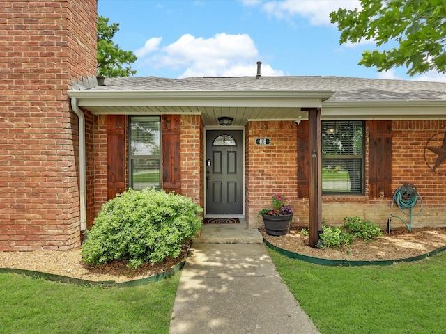 616 Stoneybrook Dr, Wylie, TX 75098 - view of exterior entry with brick siding and roof with shingles