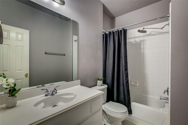 full bath featuring toilet, shower / bathtub combination with curtain, and vanity