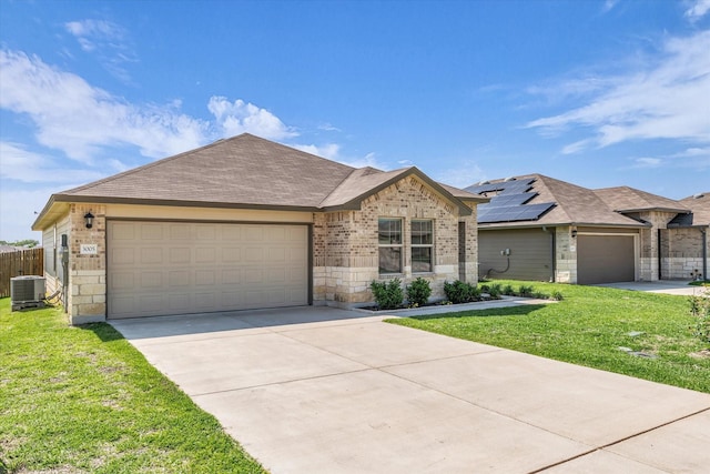 3005 Sherco Rd, Waco, TX 76655 - single story home with central AC, driveway, brick siding, an attached garage, and stone siding
