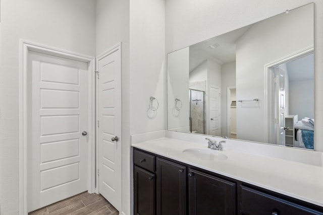 3006 Genevieve Ln, Royse City, TX 75189 - bathroom with wood finished floors, vanity, and a stall shower