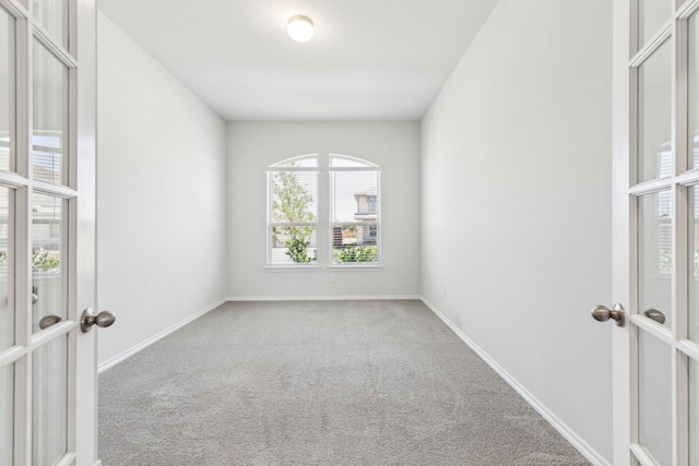3006 Genevieve Ln, Royse City, TX 75189 - spare room featuring french doors, carpet flooring, and baseboards