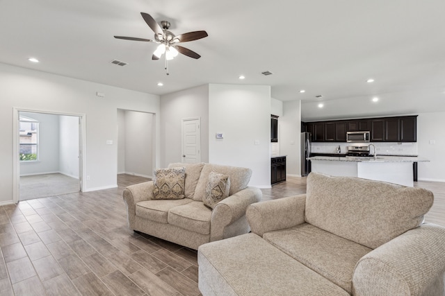 3006 Genevieve Ln, Royse City, TX 75189 - living room featuring recessed lighting, baseboards, a ceiling fan, and light wood-style flooring