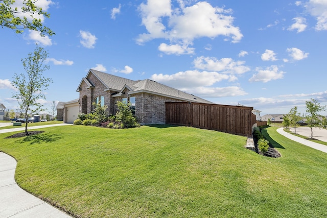 3006 Genevieve Ln, Royse City, TX 75189 - view of property exterior featuring brick siding, driveway, an attached garage, and a shingled roof