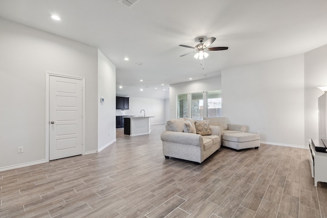 3006 Genevieve Ln, Royse City, TX 75189 - living room with a ceiling fan, light wood-type flooring, baseboards, and recessed lighting
