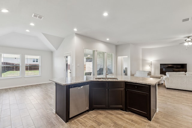 3006 Genevieve Ln, Royse City, TX 75189 - kitchen with open floor plan, stainless steel dishwasher, a sink, light stone counters, and recessed lighting