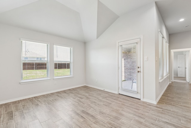 3006 Genevieve Ln, Royse City, TX 75189 - empty room with lofted ceiling, baseboards, and light wood finished floors