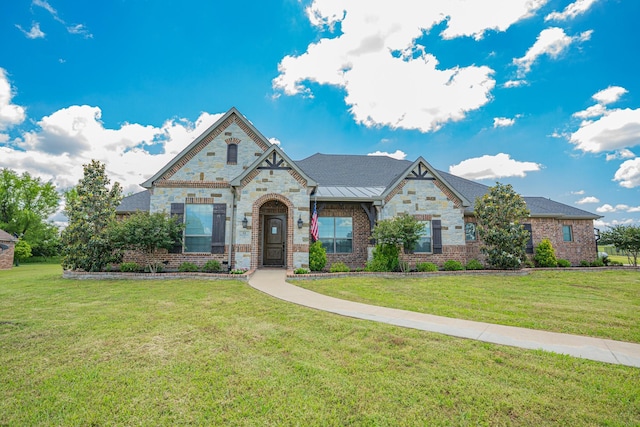44 Mirror Lakes Ct, Gunter, TX 75058 - french country inspired facade featuring a front lawn, stone siding, brick siding, and a standing seam roof