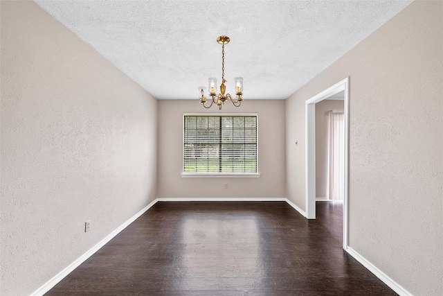 444 Lindenwood Ln W, Hewitt, TX 76643 - spare room featuring a textured wall, a chandelier, wood finished floors, a textured ceiling, and baseboards