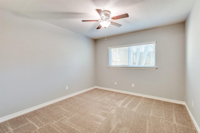 3604 Windsong Ln, Bedford, TX 76021 - carpeted empty room with ceiling fan, baseboards, and a textured ceiling