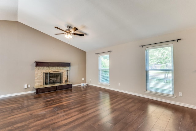 3604 Windsong Ln, Bedford, TX 76021 - unfurnished living room with vaulted ceiling, a ceiling fan, dark wood-type flooring, a fireplace, and baseboards