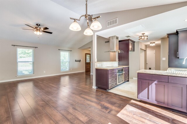 3604 Windsong Ln, Bedford, TX 76021 - kitchen with oven, vaulted ceiling, ventilation hood, open floor plan, and wood finished floors