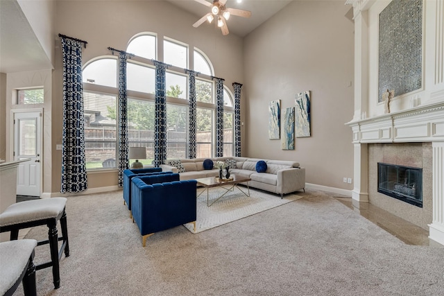 15606 Fox Meadow Ln, Frisco, TX 75035 - carpeted living area with a ceiling fan, high vaulted ceiling, baseboards, and a fireplace