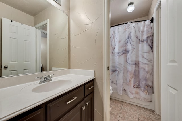 15606 Fox Meadow Ln, Frisco, TX 75035 - bathroom with vanity, toilet, tile patterned flooring, and shower / bathtub combination with curtain