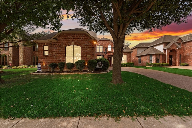 15606 Fox Meadow Ln, Frisco, TX 75035 - traditional home featuring brick siding and a lawn