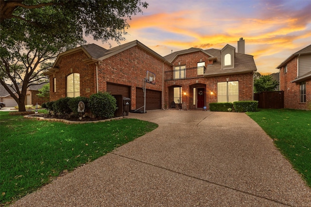 15606 Fox Meadow Ln, Frisco, TX 75035 - traditional home with brick siding, a chimney, a balcony, and driveway