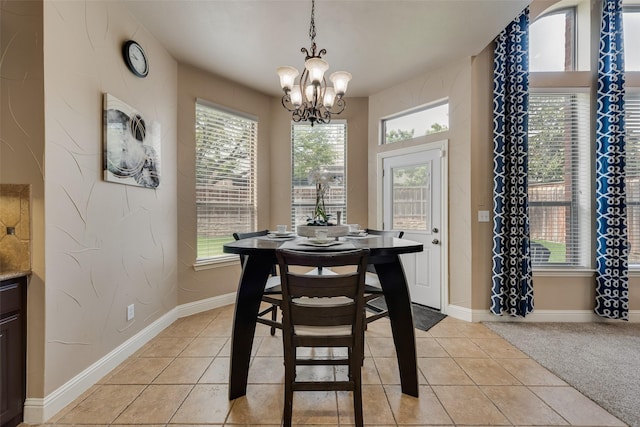 15606 Fox Meadow Ln, Frisco, TX 75035 - dining space with a chandelier, light tile patterned floors, and baseboards