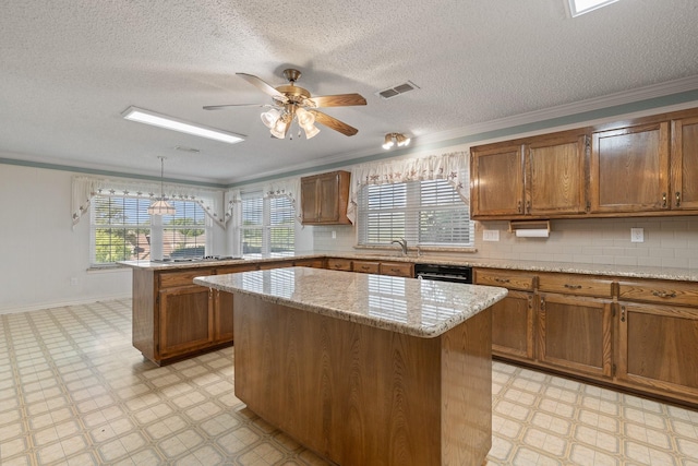 122 Clearview Ln, Fort Worth, TX 76126 - kitchen with light flooring, a peninsula, brown cabinets, a center island, and ornamental molding