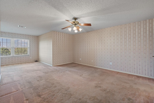 122 Clearview Ln, Fort Worth, TX 76126 - unfurnished room with carpet floors, a ceiling fan, wallpapered walls, a textured ceiling, and baseboards