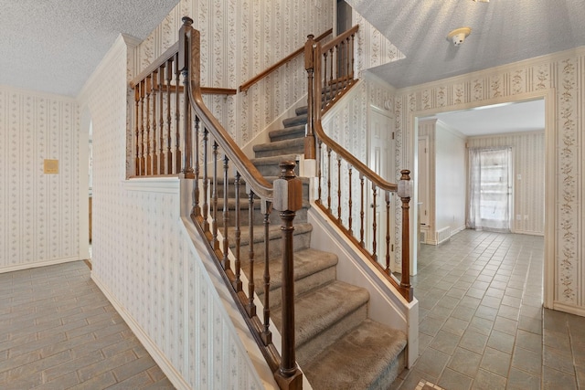 122 Clearview Ln, Fort Worth, TX 76126 - staircase featuring wallpapered walls, ornamental molding, baseboards, and a textured ceiling