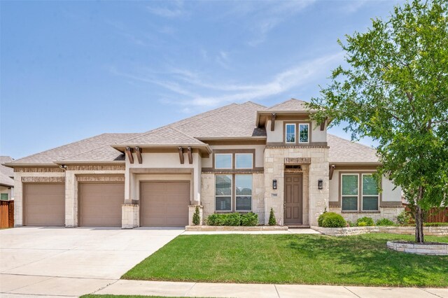 7908 Caddo Cv, Mckinney, TX 75071 - prairie-style house featuring a garage, a front lawn, stucco siding, concrete driveway, and stone siding