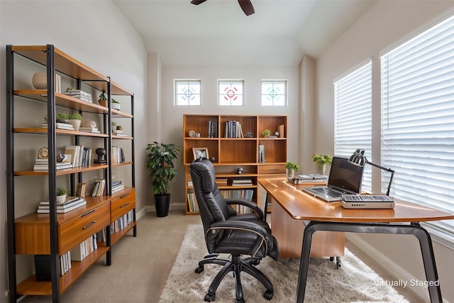 7908 Caddo Cv, Mckinney, TX 75071 - home office with vaulted ceiling, light colored carpet, a ceiling fan, and baseboards