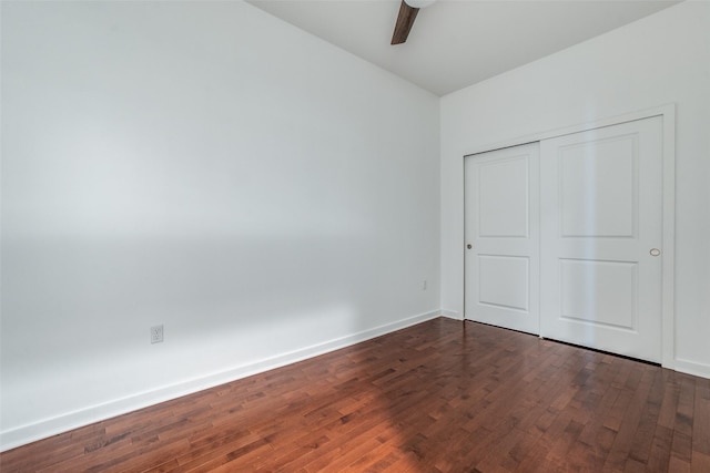 1200 Main St Unit 707, Dallas, TX 75202 - unfurnished bedroom featuring dark wood-type flooring, baseboards, and a closet