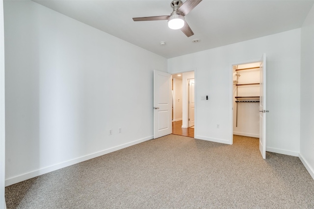 1200 Main St Unit 707, Dallas, TX 75202 - unfurnished bedroom featuring carpet floors, baseboards, a spacious closet, ceiling fan, and a closet