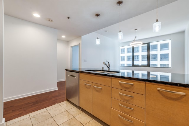 1200 Main St Unit 707, Dallas, TX 75202 - kitchen featuring a sink, stainless steel dishwasher, decorative light fixtures, light tile patterned floors, and recessed lighting