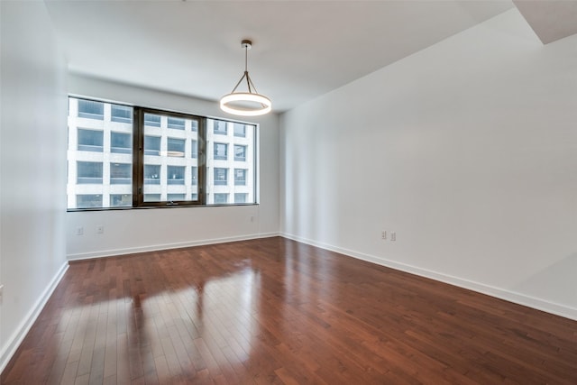 1200 Main St Unit 707, Dallas, TX 75202 - spare room with dark wood-style floors and baseboards
