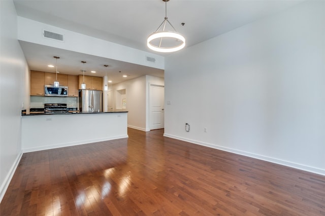 1200 Main St Unit 707, Dallas, TX 75202 - unfurnished living room with dark wood-style flooring and baseboards