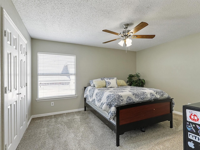 7425 Quiet Meadow Ln, Frisco, TX 75033 - bedroom featuring carpet floors, baseboards, a ceiling fan, a closet, and a textured ceiling
