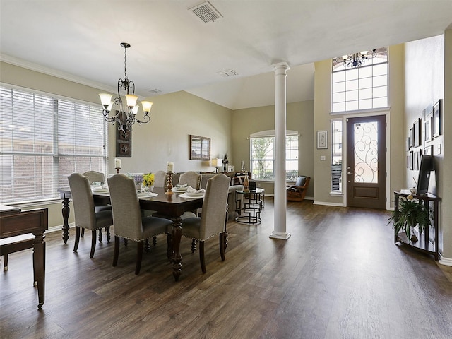 7425 Quiet Meadow Ln, Frisco, TX 75033 - dining room featuring a chandelier, dark wood-type flooring, ornate columns, and baseboards
