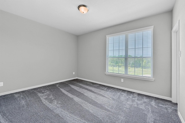 1017 Lade Ct, Celina, TX 75009 - spare room with dark colored carpet and baseboards