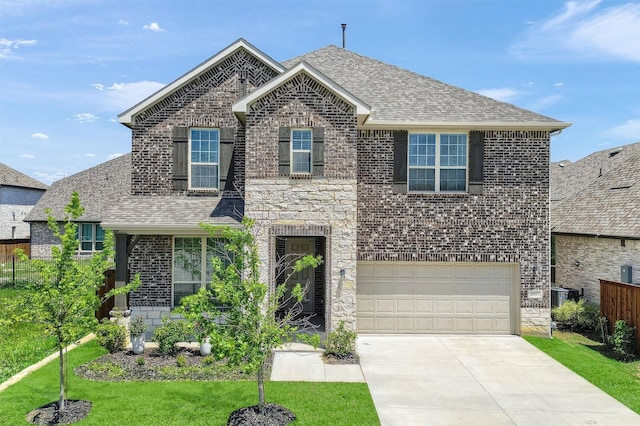 1017 Lade Ct, Celina, TX 75009 - traditional home with a shingled roof, brick siding, concrete driveway, and a garage