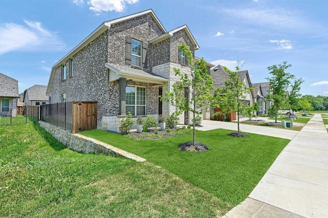 1017 Lade Ct, Celina, TX 75009 - view of front facade featuring brick siding, concrete driveway, stone siding, and a residential view