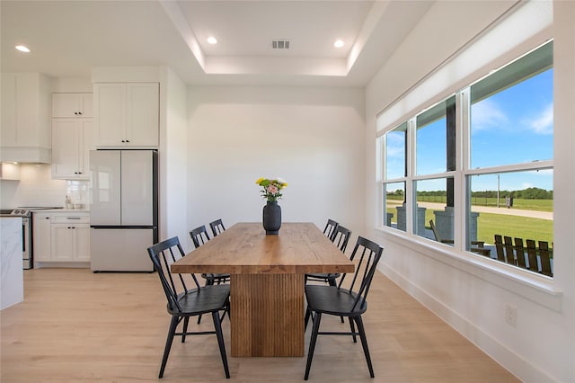 1339 Malone Dr, Royse City, TX 75189 - dining area with light wood-type flooring, recessed lighting, a tray ceiling, and baseboards