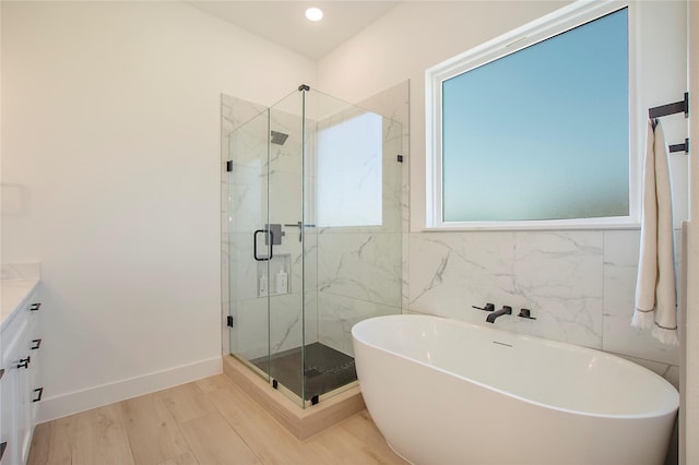1339 Malone Dr, Royse City, TX 75189 - full bathroom featuring vanity, a freestanding bath, a marble finish shower, baseboards, and recessed lighting