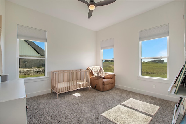 1339 Malone Dr, Royse City, TX 75189 - bedroom featuring carpet floors, baseboards, a nursery area, and a ceiling fan