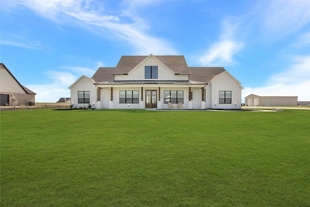 1339 Malone Dr, Royse City, TX 75189 - back of house featuring a standing seam roof, a lawn, and metal roof