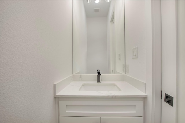 1339 Malone Dr, Royse City, TX 75189 - bathroom featuring a textured wall and vanity