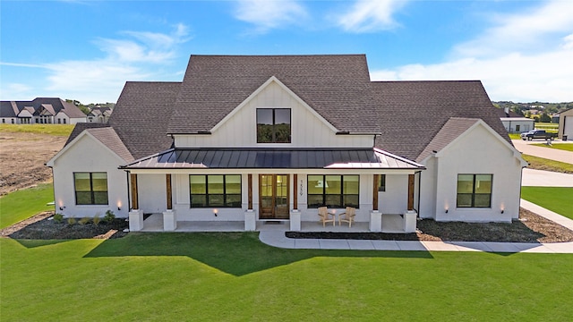1339 Malone Dr, Royse City, TX 75189 - rear view of property with a standing seam roof, a yard, metal roof, and roof with shingles