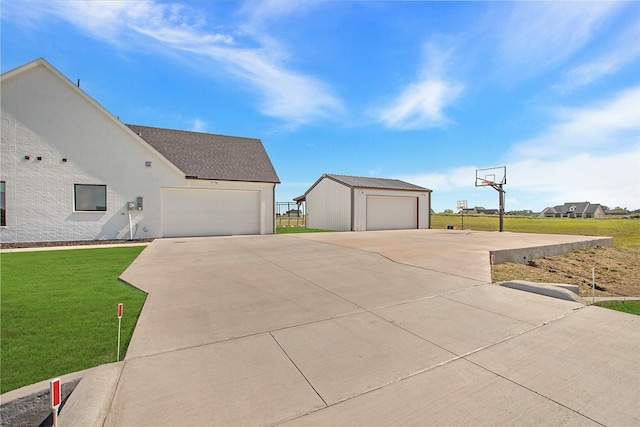 1339 Malone Dr, Royse City, TX 75189 - view of property exterior featuring a yard, an outdoor structure, and a detached garage