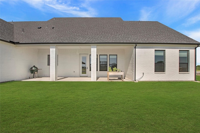 1339 Malone Dr, Royse City, TX 75189 - rear view of property with a shingled roof, a patio area, a lawn, and brick siding