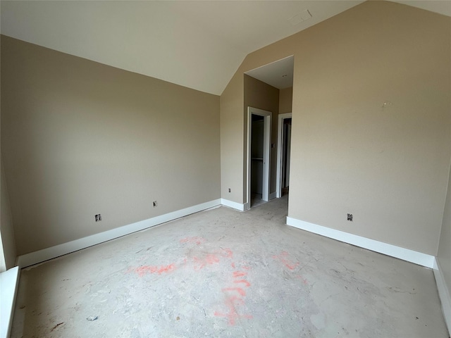 436 Guadalupe Trl, Springtown, TX 76087 - empty room with concrete floors, lofted ceiling, and baseboards