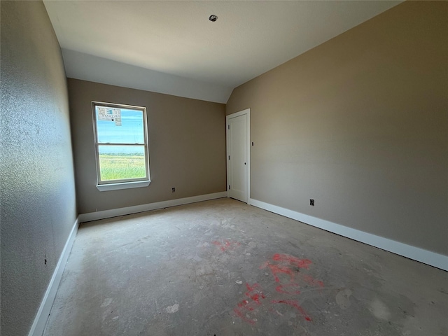 436 Guadalupe Trl, Springtown, TX 76087 - unfurnished room featuring concrete floors, baseboards, and lofted ceiling