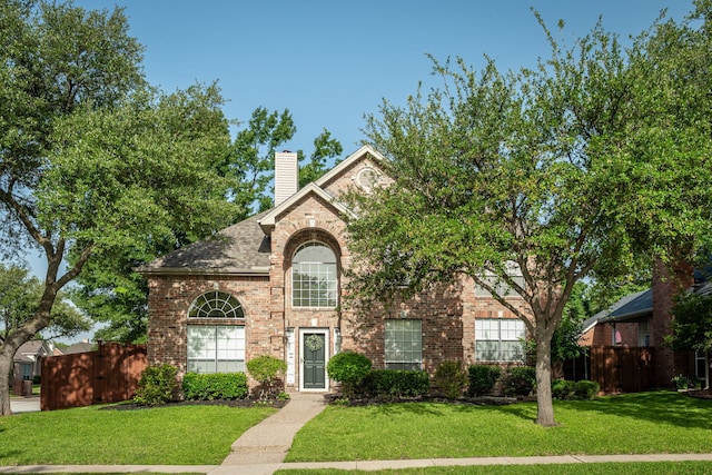 7901 Cross Plains Dr, Plano, TX 75025 - traditional-style house featuring brick siding and a chimney