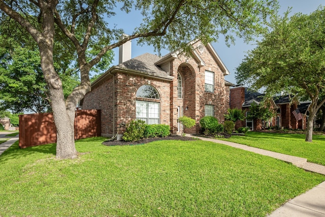 7901 Cross Plains Dr, Plano, TX 75025 - traditional-style home featuring brick siding, a chimney, and a shingled roof