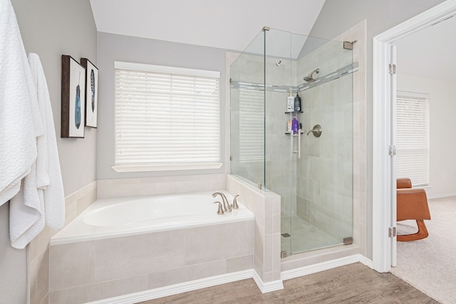 7901 Cross Plains Dr, Plano, TX 75025 - bathroom featuring a stall shower, a garden tub, wood finished floors, and vaulted ceiling